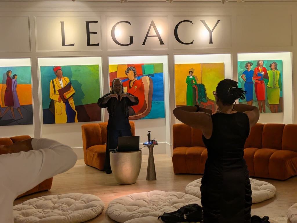 Heru TchaasAmen leading a session with a participant, Breathing Black Love Series at WOW Gallery